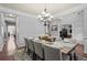 Bright and airy dining room with hardwood flooring, chandelier, and ample seating at 331 Spotted Ridge Cir, Woodstock, GA 30188