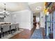 Dining room showcasing hardwood floors, a chandelier, and views of adjacent rooms at 331 Spotted Ridge Cir, Woodstock, GA 30188