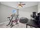 A home gym featuring two stationary bikes, a bean bag, and other workout equipment at 331 Spotted Ridge Cir, Woodstock, GA 30188
