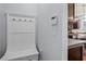 This hallway has coat hooks and a place to sit while putting on shoes at 331 Spotted Ridge Cir, Woodstock, GA 30188