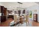 Elegant eat-in kitchen area with stainless steel appliances, dark wood cabinets and hardwood floors at 331 Spotted Ridge Cir, Woodstock, GA 30188