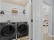 Laundry room featuring new LG washer and dryer units and wire shelving at 331 Spotted Ridge Cir, Woodstock, GA 30188