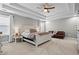 This main bedroom features neutral paint, a seating area, tray ceiling and ample space at 331 Spotted Ridge Cir, Woodstock, GA 30188