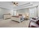 Spacious main bedroom boasts a tray ceiling, natural light, and ample space for relaxation at 331 Spotted Ridge Cir, Woodstock, GA 30188