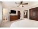 The main bedroom includes a dresser with a TV, two closets, and an en suite bathroom for convenience at 4646 Mountain Creek Ne Dr, Roswell, GA 30075