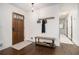 Welcoming entryway with hardwood floors, coat rack, and bench seating at 4646 Mountain Creek Ne Dr, Roswell, GA 30075