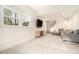 This living room features a TV, stairs, and a comfy couch at 4646 Mountain Creek Ne Dr, Roswell, GA 30075