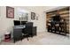Home office setup with a desk, multiple monitors, and rustic wood accent wall at 4646 Mountain Creek Ne Dr, Roswell, GA 30075