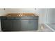 New bathroom vanity with dark cabinets and silver hardware being installed at 5114 Arista Dr, Douglasville, GA 30135