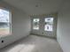 Spacious bedroom featuring natural light from several windows with fresh paint at 5114 Arista Dr, Douglasville, GA 30135