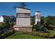 Stone monument sign featuring the Laurelwood community name, surrounded by colorful landscaping at 5114 Arista Dr, Douglasville, GA 30135
