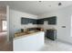 Unfinished kitchen featuring gray cabinets, white walls, and an unfinished island in an open layout concept at 5114 Arista Dr, Douglasville, GA 30135