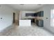 Unfinished kitchen featuring gray cabinets, white walls, and an unfinished island in an open layout concept at 5114 Arista Dr, Douglasville, GA 30135