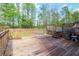 Backyard features a wooden deck with access to an above ground swimming pool at 527 Mossycup Dr, Fairburn, GA 30213