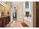 Bathroom featuring double vanity, soaking tub, and walk-in shower at 527 Mossycup Dr, Fairburn, GA 30213