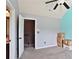 Bright bedroom with stairs, a ceiling fan, and an accent wall at 527 Mossycup Dr, Fairburn, GA 30213