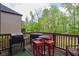 Outdoor deck area features grilling and seating space, perfect for entertaining at 527 Mossycup Dr, Fairburn, GA 30213