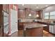 Well-equipped kitchen with granite countertops, stainless steel appliances, and custom cabinetry at 527 Mossycup Dr, Fairburn, GA 30213