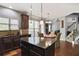 Well-equipped kitchen with granite countertops, stainless steel appliances, and custom cabinetry at 527 Mossycup Dr, Fairburn, GA 30213