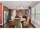 Well-equipped kitchen with granite countertops, stainless steel appliances, and custom cabinetry at 527 Mossycup Dr, Fairburn, GA 30213