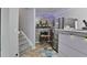 View of the kitchenette featuring stone accent wall, stainless steel refrigerator and microwave at 527 Mossycup Dr, Fairburn, GA 30213