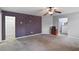 View of living room space and bar area featuring a unique clock on the wall at 527 Mossycup Dr, Fairburn, GA 30213