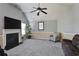 Cozy living room with fireplace and neutral color scheme at 527 Mossycup Dr, Fairburn, GA 30213