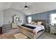 A main bedroom with a sitting area and ensuite bath at 527 Mossycup Dr, Fairburn, GA 30213