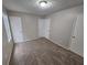 Bedroom with carpeted floors and white doors at 6301 Creekford Dr, Lithonia, GA 30058