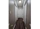 Hallway featuring wood floors and white doors at 6301 Creekford Dr, Lithonia, GA 30058