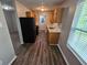 Modern kitchen with wood cabinets, granite counters, and stainless steel appliances at 6301 Creekford Dr, Lithonia, GA 30058