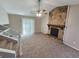 Inviting living room boasting a striking stone fireplace and sliding glass doors for natural light at 6301 Creekford Dr, Lithonia, GA 30058