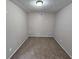 Neutral-toned room featuring wall-to-wall carpeting and a clean, minimalist design at 6301 Creekford Dr, Lithonia, GA 30058