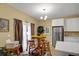 Eat-in dining area with a table and chairs, adjacent to the bright and modern kitchen at 6880 Robinson St, Lithonia, GA 30058