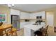 Well-lit kitchen with stainless steel appliances, white cabinetry, and a center island at 6880 Robinson St, Lithonia, GA 30058