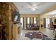 Spacious living room features a stone fireplace, laminate floors, and large windows at 6880 Robinson St, Lithonia, GA 30058