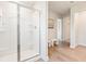 Modern bathroom with a glass-enclosed shower, sleek design, and wood look flooring at 1020 Sutherland Lane (Lot 43), Lawrenceville, GA 30043