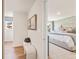 Hallway leading to bedroom featuring neutral walls, with views to a comfortable main bedroom suite at 1020 Sutherland Lane (Lot 43), Lawrenceville, GA 30043