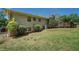 Well-maintained lawn with bushes, shrubs, and view of deck at 1048 Tumblewood Trl, Lawrenceville, GA 30044