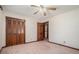 Bedroom with neutral walls and carpet and a ceiling fan at 1048 Tumblewood Trl, Lawrenceville, GA 30044