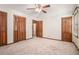 Bedroom featuring neutral walls, carpet, and wood trim at 1048 Tumblewood Trl, Lawrenceville, GA 30044