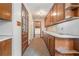 Hallway with wood cabinets, light walls and patterned carpet at 1048 Tumblewood Trl, Lawrenceville, GA 30044