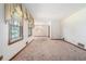 Spacious living room featuring large windows and vintage design elements at 1048 Tumblewood Trl, Lawrenceville, GA 30044
