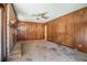 Spacious living room with brick fireplace and paneled walls, perfect for cozy evenings at 1048 Tumblewood Trl, Lawrenceville, GA 30044