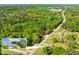 Drone shot of a real estate lot with a home and lots of trees at 12042 Brown Bridge Rd, Covington, GA 30016