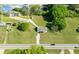 Aerial view of property with a white home and a long driveway with trees at 12042 Brown Bridge Rd, Covington, GA 30016