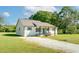 Charming home with a bright blue front door and a well-maintained yard on a sunny day at 12042 Brown Bridge Rd, Covington, GA 30016