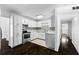 Bright kitchen featuring white cabinets, tile backsplash, and stainless steel appliances at 12042 Brown Bridge Rd, Covington, GA 30016