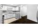 Modern kitchen featuring white cabinets, granite countertops, tile backsplash, and stainless steel appliances at 12042 Brown Bridge Rd, Covington, GA 30016