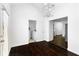 Laundry area featuring modern appliances, dark hardwood flooring, and open layout near an entrance at 12042 Brown Bridge Rd, Covington, GA 30016